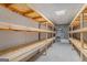 Basement storage area with multiple wooden shelves at 225 Chinns Way, Hampton, GA 30228