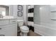 Bathroom featuring a shower/tub combo with black and white curtains, toilet, and vanity at 10454 Trellis Lane (Lot 39), Hampton, GA 30228