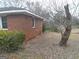 Brick house with tree and leaves scattered on the yard at 106 Flippen Rd, Stockbridge, GA 30281