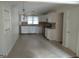 This bright kitchen features white cabinets, stainless steel appliances and a tile backsplash at 106 Flippen Rd, Stockbridge, GA 30281