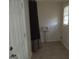 Laundry room equipped with hook ups, tiled floor, window, and a door at 106 Flippen Rd, Stockbridge, GA 30281