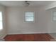 Sunlit living room boasts gleaming hardwood floors and neutral walls, creating a warm and inviting atmosphere at 106 Flippen Rd, Stockbridge, GA 30281