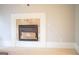 Inviting fireplace with tan tile surround with a decorative white mantle at 956 Shadowford Fls, Lithonia, GA 30058