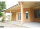 Covered patio with stucco columns, concrete flooring, and neutral paint, perfect for outdoor entertaining at 956 Shadowford Fls, Lithonia, GA 30058