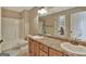 Bathroom view featuring a shower/tub combo and double sink vanity at 755 Becky Ct, Fayetteville, GA 30214