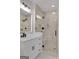 Modern bathroom with a white vanity, quartz countertop, and glass-enclosed walk-in shower at 118 Via Roma, Woodstock, GA 30188