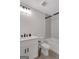 Clean bathroom with white subway tile, modern vanity, and shower-tub combination at 118 Via Roma, Woodstock, GA 30188