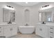 Luxury bathroom featuring dual sinks, soaking tub and tile floors at 118 Via Roma, Woodstock, GA 30188
