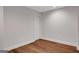 Clean, minimalist bedroom with hardwood floors, modern trim, and recessed lighting at 118 Via Roma, Woodstock, GA 30188