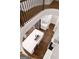 Aerial view of bright kitchen featuring a large island with counter seating and stainless appliances at 118 Via Roma, Woodstock, GA 30188