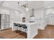 Bright kitchen featuring a large island with counter seating and stainless appliances at 118 Via Roma, Woodstock, GA 30188