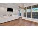 Beautiful living room with hardwood floors, coffered ceilings, and large windows at 118 Via Roma, Woodstock, GA 30188