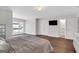 Comfortable main bedroom with hardwood floors, modern lighting, and ensuite bathroom at 118 Via Roma, Woodstock, GA 30188