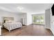 Spacious main bedroom with hardwood floors, large windows, and modern finishes at 118 Via Roma, Woodstock, GA 30188