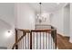Second story landing featuring decorative iron and wood staircase at 118 Via Roma, Woodstock, GA 30188