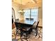 Charming dining room with a chandelier, table with seating for six and a decorative rug at 611 Winners Cir, Locust Grove, GA 30248