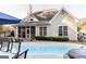 Backyard featuring a swimming pool with hot tub, perfect for summer fun at 104 Summer Chase, Carrollton, GA 30116