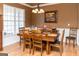 Bright dining area with large window and classic table set for six at 104 Summer Chase, Carrollton, GA 30116