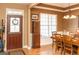 Elegant dining room featuring hardwood floors and a classic chandelier at 104 Summer Chase, Carrollton, GA 30116