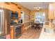 Eat-in kitchen featuring stainless steel appliances, granite countertops, and tile floors at 104 Summer Chase, Carrollton, GA 30116