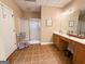 Bathroom featuring a walk-in shower, vanity area, and tiled flooring at 8179 Pineview Ct, Villa Rica, GA 30180