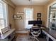 Bright home office featuring a modern desk setup and natural light from the large window at 8179 Pineview Ct, Villa Rica, GA 30180