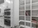 A stylish pantry features sleek white shelving, providing ample storage for kitchen essentials at 645 Timberbrook Dr, Sharpsburg, GA 30277