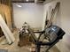 Unfinished basement featuring concrete floor, exposed ceiling, a treadmill and building supplies at 281 Timber Laurel Ln, Lawrenceville, GA 30043