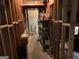Unfinished basement with wood framing, exposed shelving, and building materials throughout at 281 Timber Laurel Ln, Lawrenceville, GA 30043
