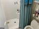 Tiled shower stall with a shower curtain and storage shelving at 281 Timber Laurel Ln, Lawrenceville, GA 30043