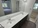 Bathroom showcasing double vanity, large mirror, tub and great lighting at 281 Timber Laurel Ln, Lawrenceville, GA 30043
