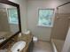 Bathroom with granite countertop, vanity mirror, hexagon tile floor, tub and window at 281 Timber Laurel Ln, Lawrenceville, GA 30043