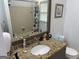 Bathroom features granite countertop, an undermount sink, and a shower with tile surround at 281 Timber Laurel Ln, Lawrenceville, GA 30043