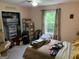 A bedroom featuring a window, closet, and personal belongings on the bed and floor at 281 Timber Laurel Ln, Lawrenceville, GA 30043