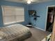 Cozy bedroom features a ceiling fan, a mounted TV and a window with blinds at 281 Timber Laurel Ln, Lawrenceville, GA 30043