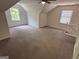 Spacious bonus room features vaulted ceiling, ceiling fan, carpet and two windows for ample light at 281 Timber Laurel Ln, Lawrenceville, GA 30043