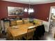 Spacious dining room with hardwood floors and elegant chandelier at 281 Timber Laurel Ln, Lawrenceville, GA 30043