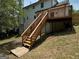 Exterior of the home showing wooden steps leading to the deck at 281 Timber Laurel Ln, Lawrenceville, GA 30043