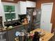 Functional kitchen with stainless steel appliances and gray cabinetry at 281 Timber Laurel Ln, Lawrenceville, GA 30043