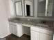 Bathroom features double sink with stone countertop and modern finishes at 1224 Hibiscus Way, Mcdonough, GA 30253