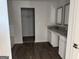 Bathroom features double sink with stone countertop and modern finishes at 1224 Hibiscus Way, Mcdonough, GA 30253
