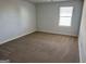 Bedroom with neutral carpet and natural light at 1224 Hibiscus Way, Mcdonough, GA 30253