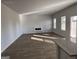 Bright, empty living room featuring neutral walls, wood-look flooring, and a modern electric fireplace at 1224 Hibiscus Way, Mcdonough, GA 30253