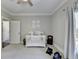 Cozy Bedroom featuring a white crib, soft gray walls, and elephant decor at 2892 Darlington Run, Duluth, GA 30097