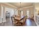 Bright dining room with hardwood floors, and elegant lighting at 2892 Darlington Run, Duluth, GA 30097