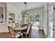 Dining room with a large table, built-in shelves, and a view of the outdoor pool area at 2892 Darlington Run, Duluth, GA 30097