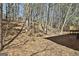 Secluded backyard featuring a wooded lot with a patio, offering a private outdoor space at 5938 Rock Ct, Union City, GA 30291