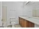 Traditional bathroom featuring a tiled shower/tub, neutral walls, a toilet, and a vanity sink at 5938 Rock Ct, Union City, GA 30291