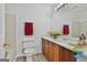 Well-lit bathroom with traditional vanity, neutral tiles, and modern fixtures at 5938 Rock Ct, Union City, GA 30291
