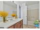 Neat bathroom features a vanity with a large mirror, bathtub, and shower combo at 5938 Rock Ct, Union City, GA 30291